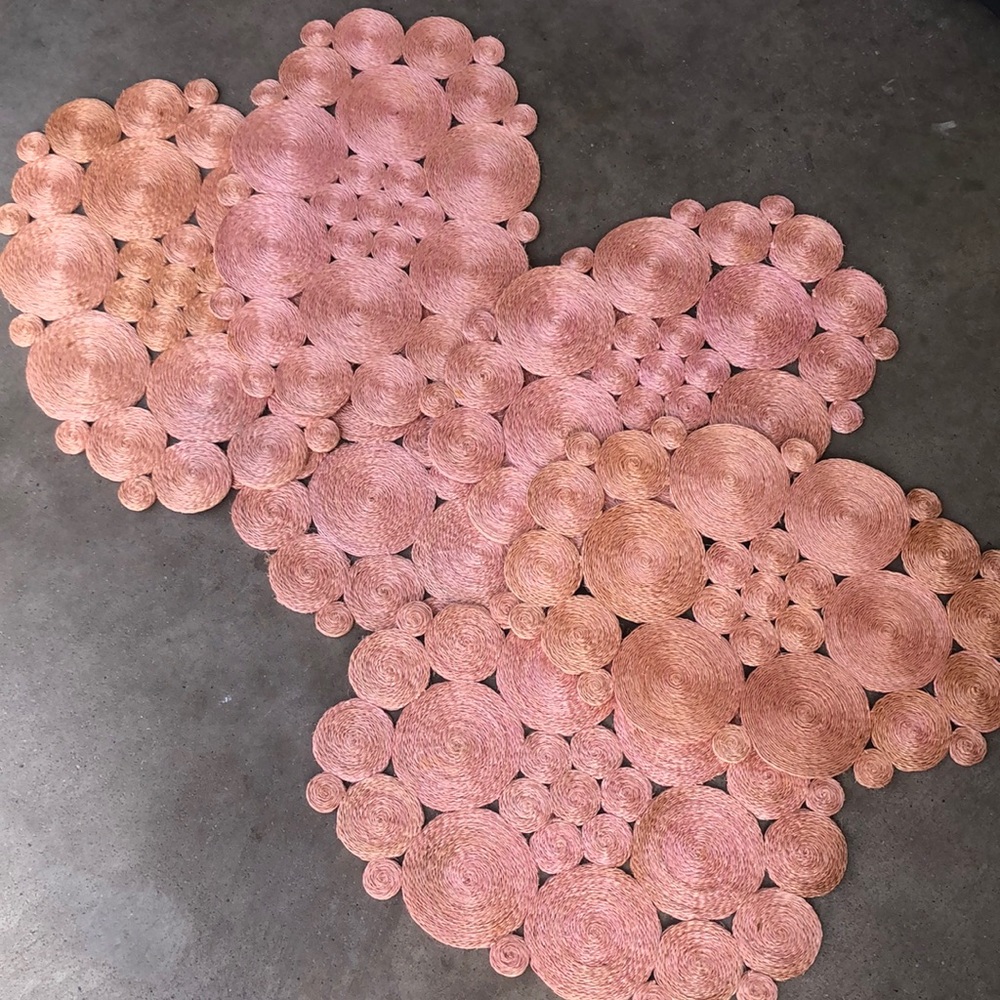 Six pink and natural color placemats